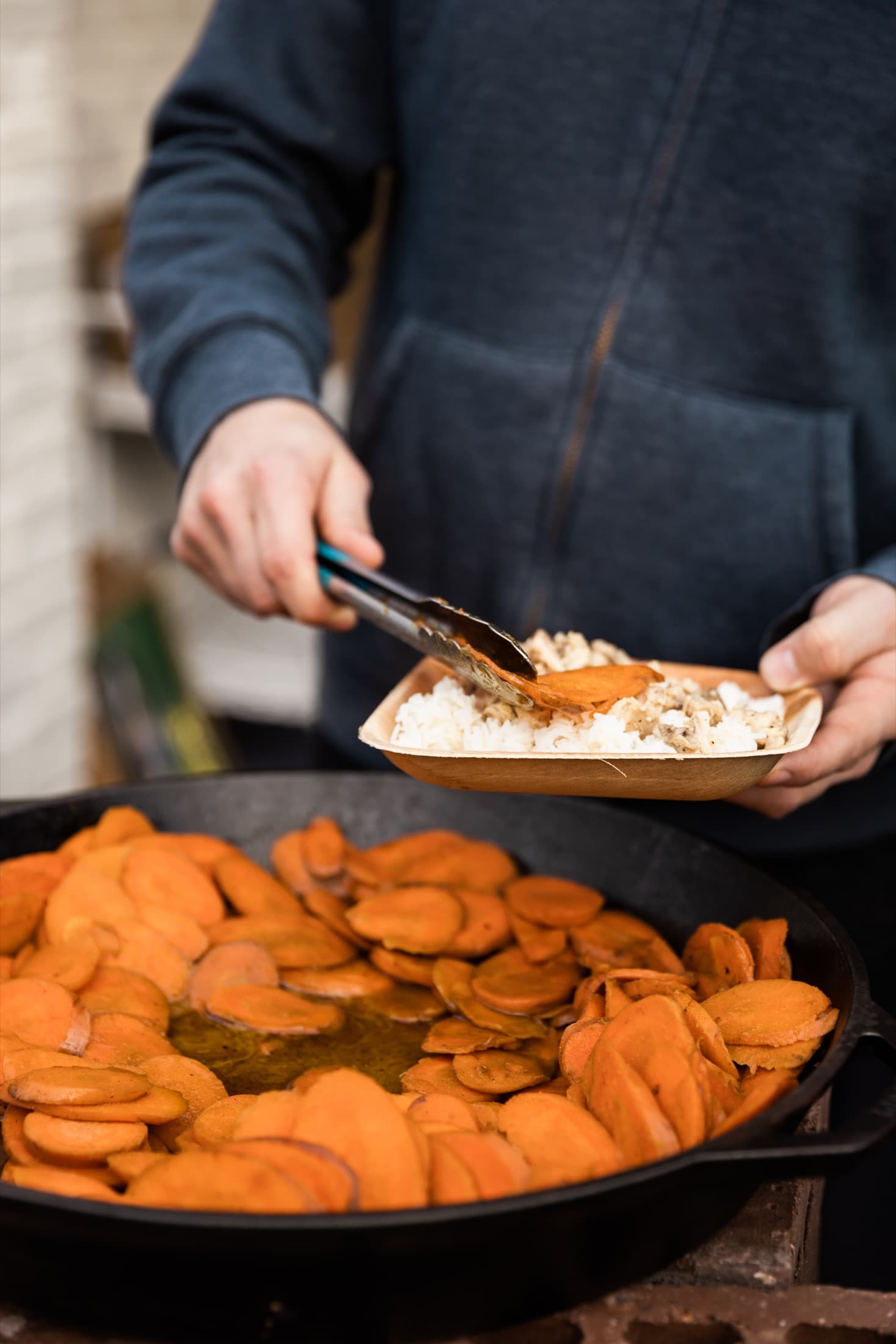 Caterer plating food at an event